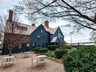 A House With Bushes In Front Of House Of The Seven Gables