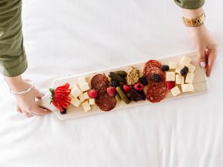 Charcuterie on bed at Sentinel Hotel in Portland Oregon